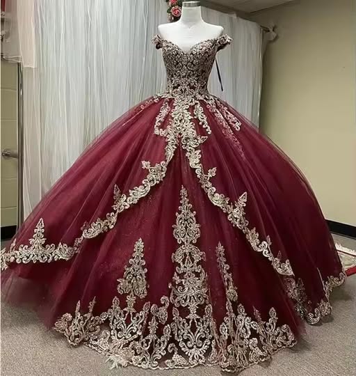 burgundy ball gown with intricate lace applique