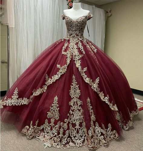 ball gown quince dress in deep burgundy tulle with intricate gold lace applique