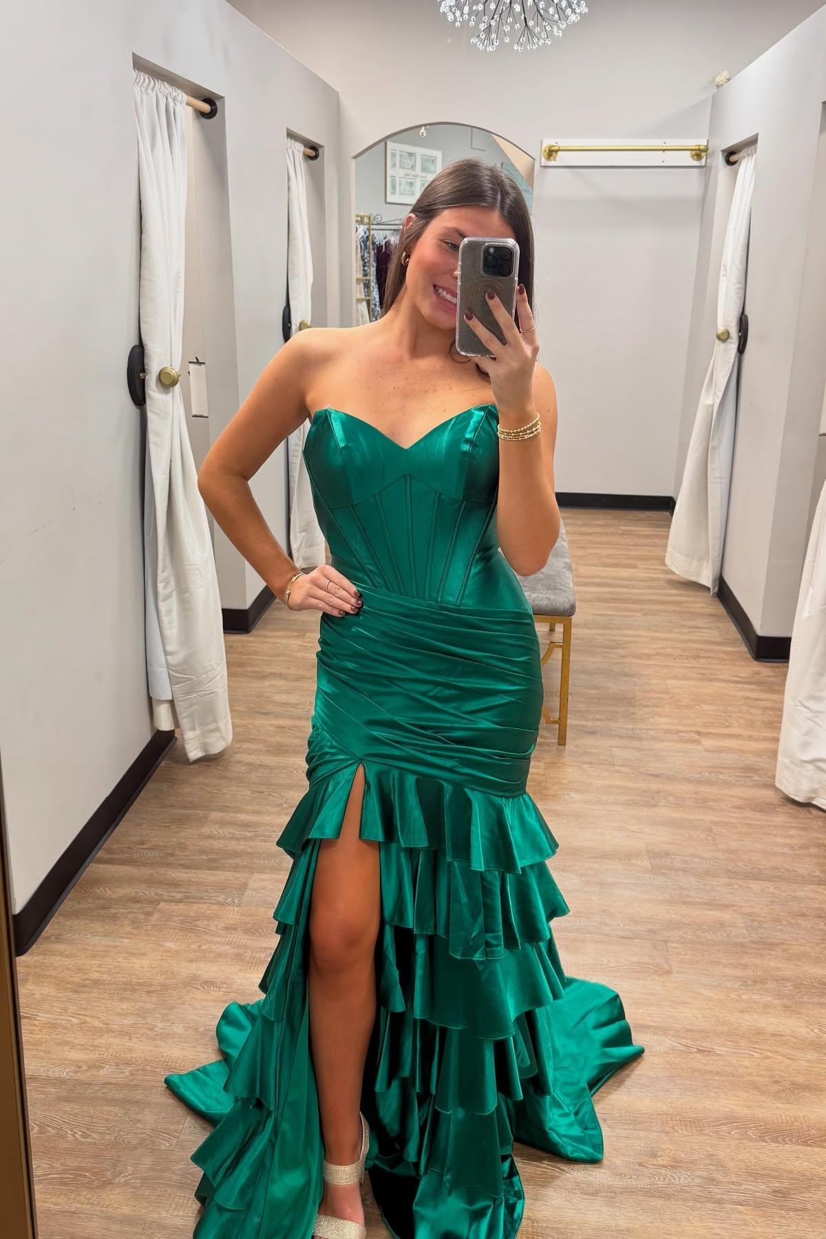 Green strapless tiered stretch satin prom dress with a mermaid silhouette and a slit
