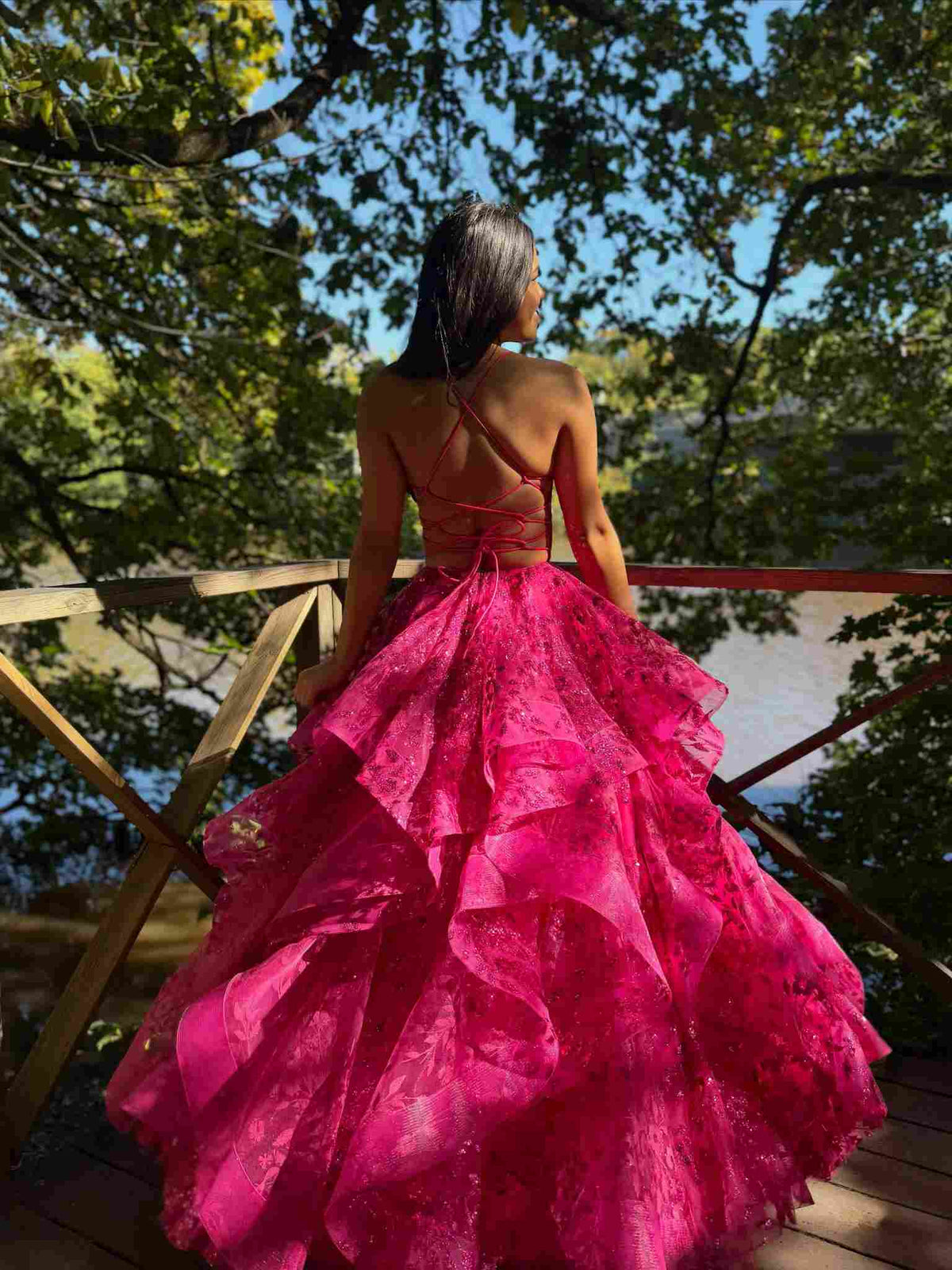 pink quinceañera ball gown with a lace bodice and layered tulle skirt