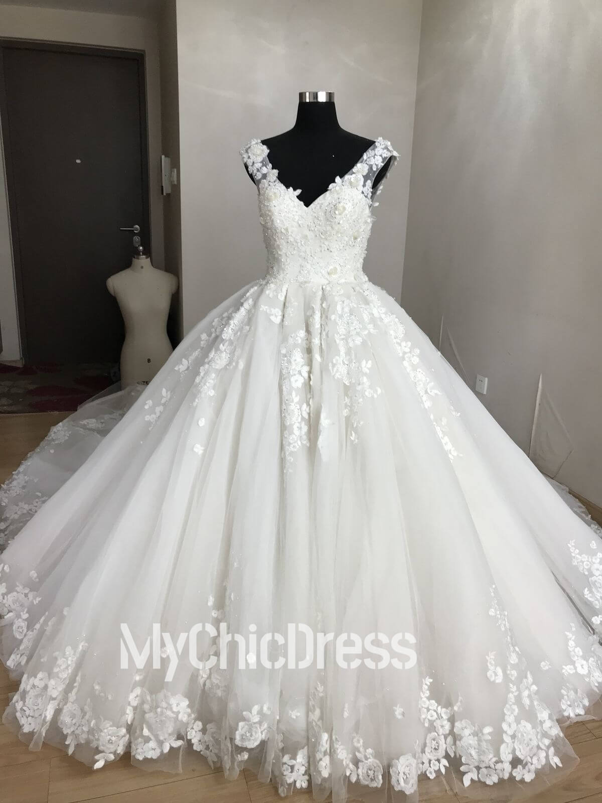 White ball gown wedding dress with floral lace appliques