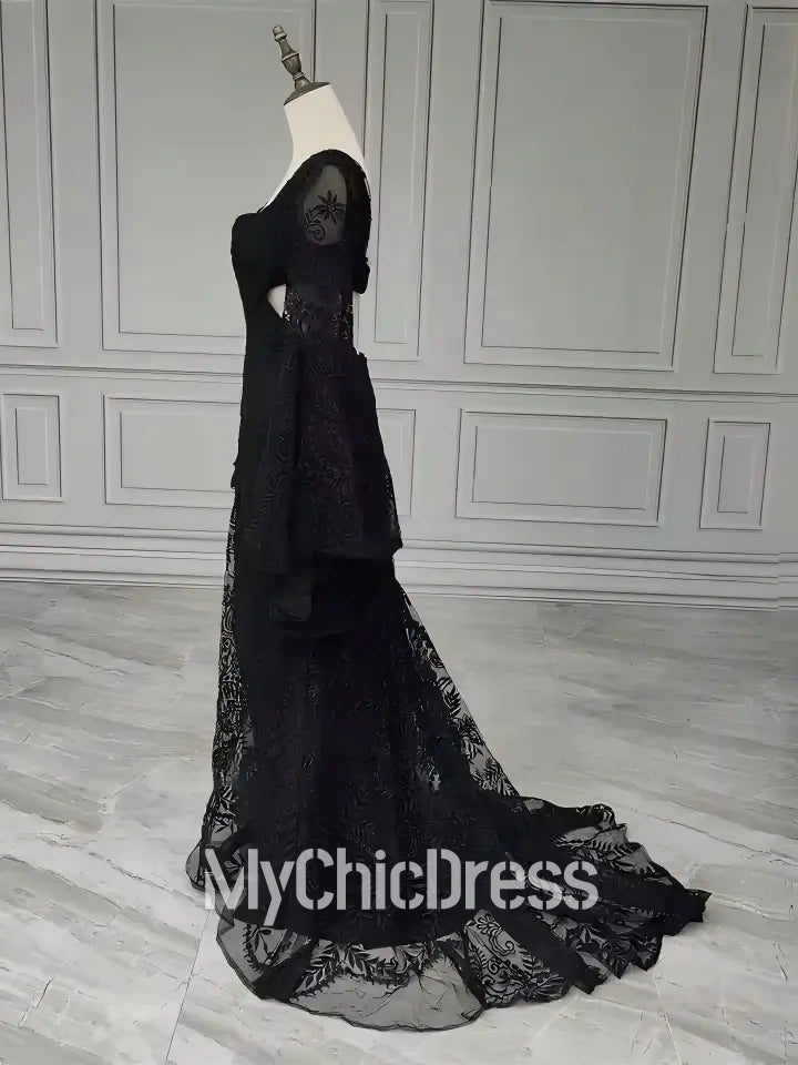 Vestido de novia bohemio de encaje negro con mangas acampanadas para una novia bohemia caprichosa