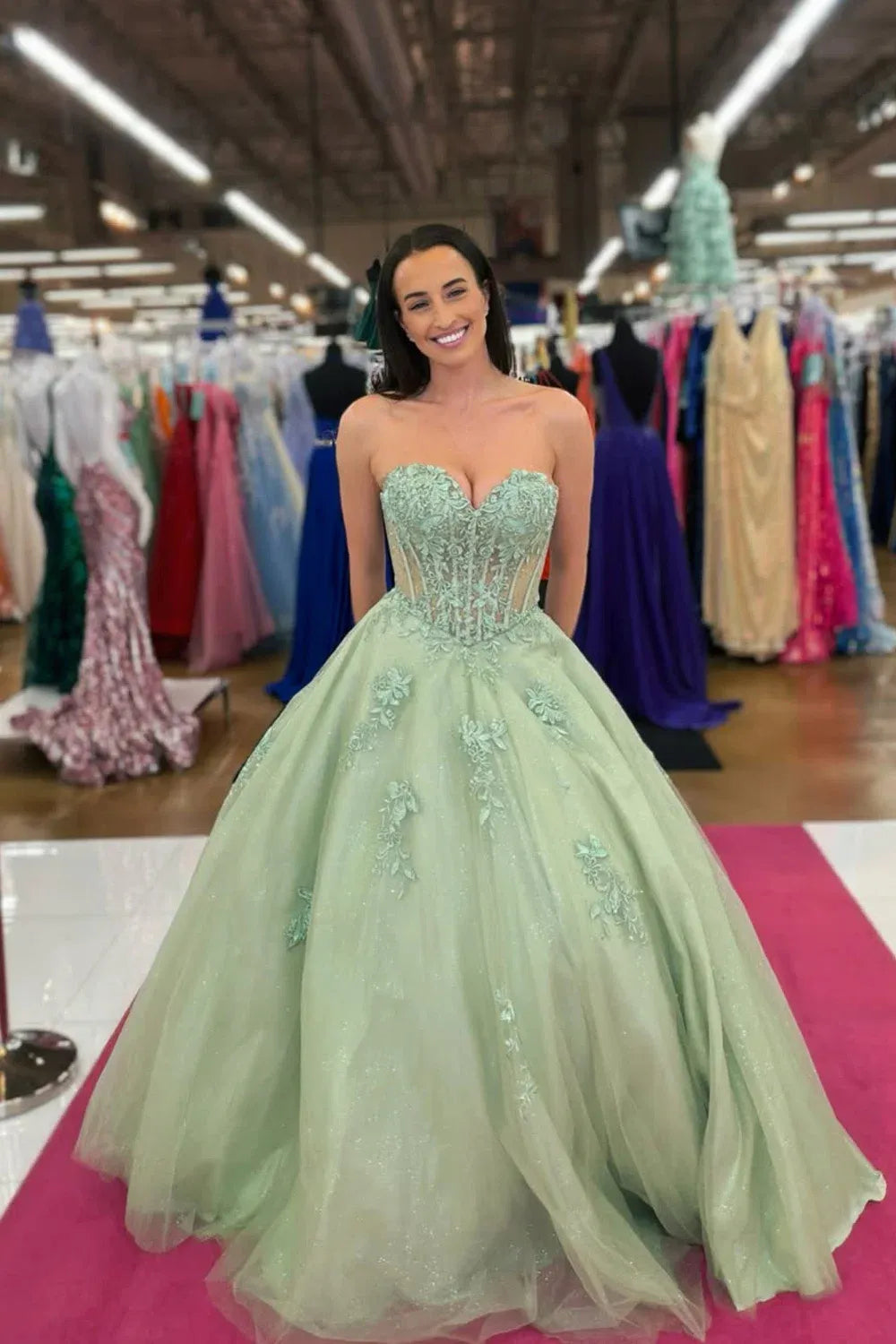 strapless mint green ball gown with a sweetheart neckline, beaded bodice, and voluminous tulle skirt
