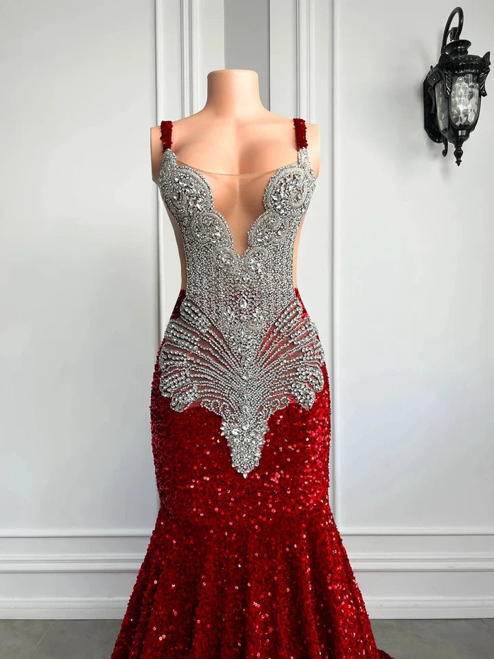 A red mermaid-style evening gown with heavy silver beading and sequins