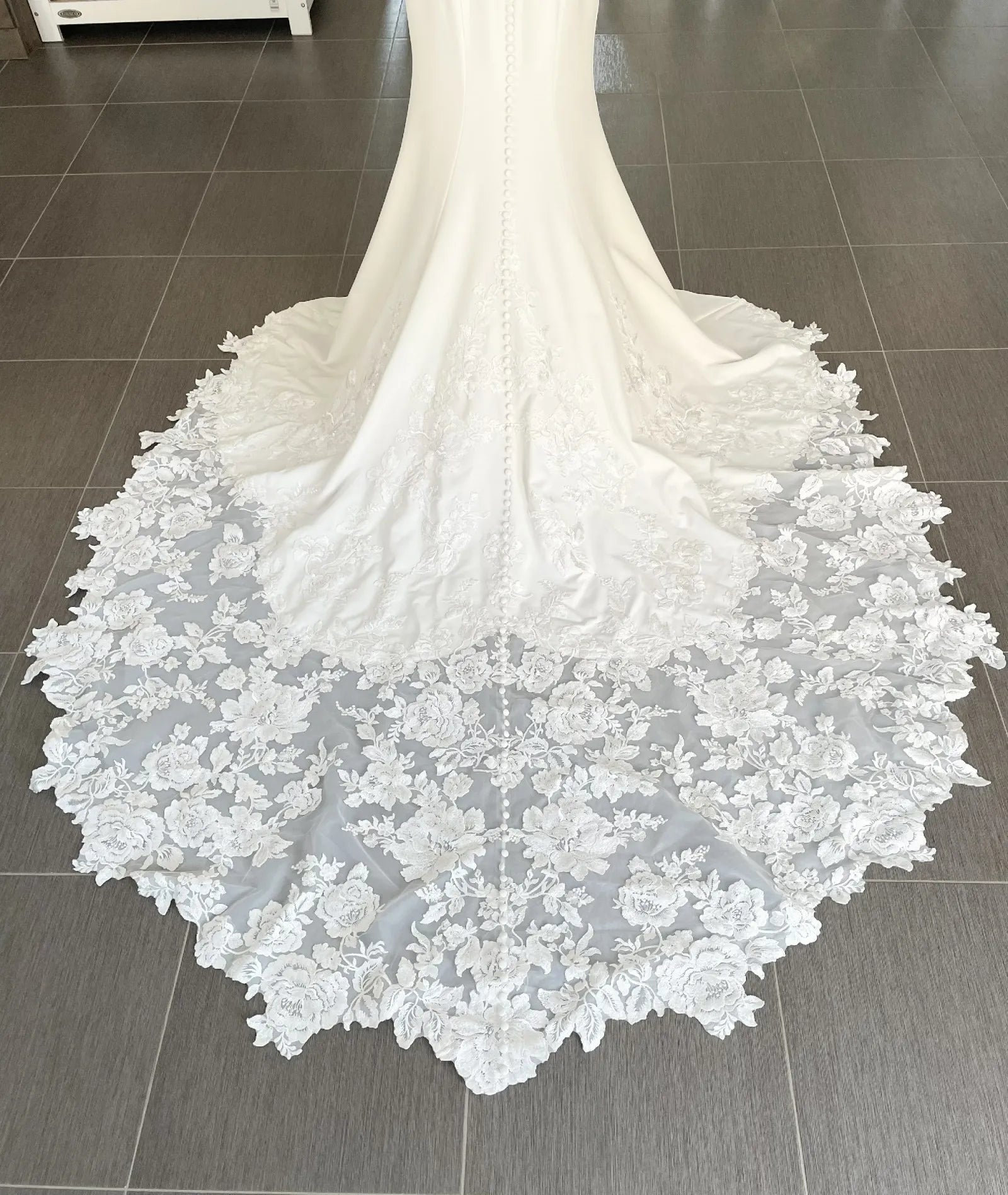 Close-up of a white lace wedding dress
