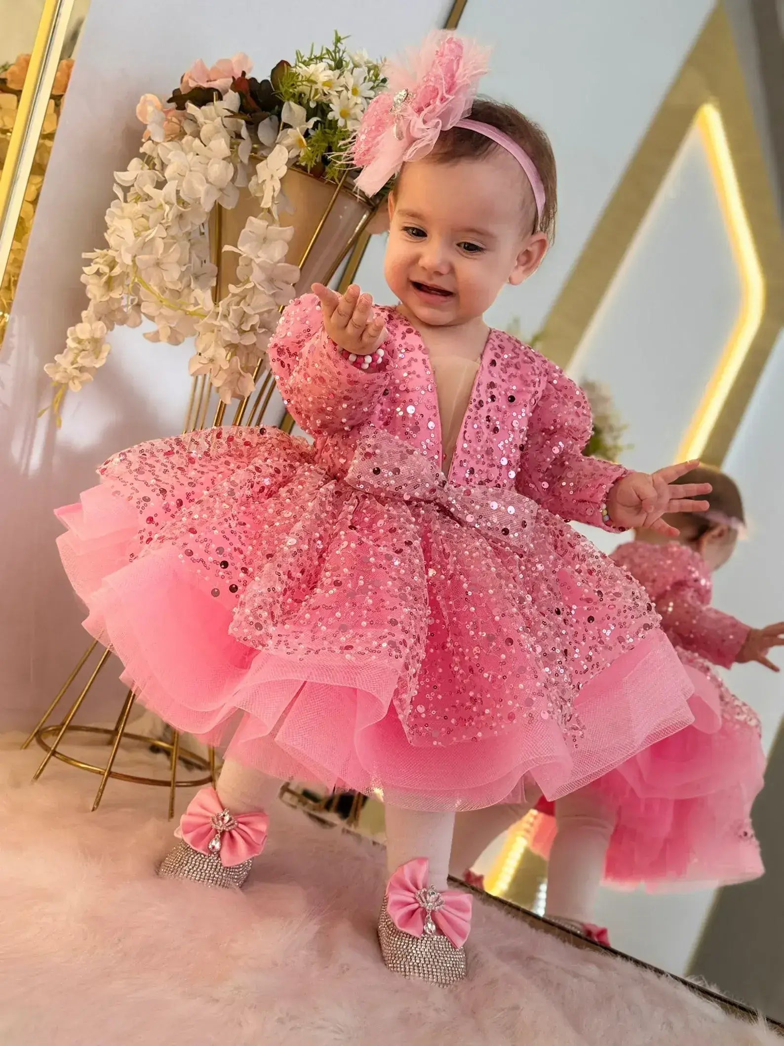 sparkling pink sequined ball gown with a matching pink headband and pink bow shoes