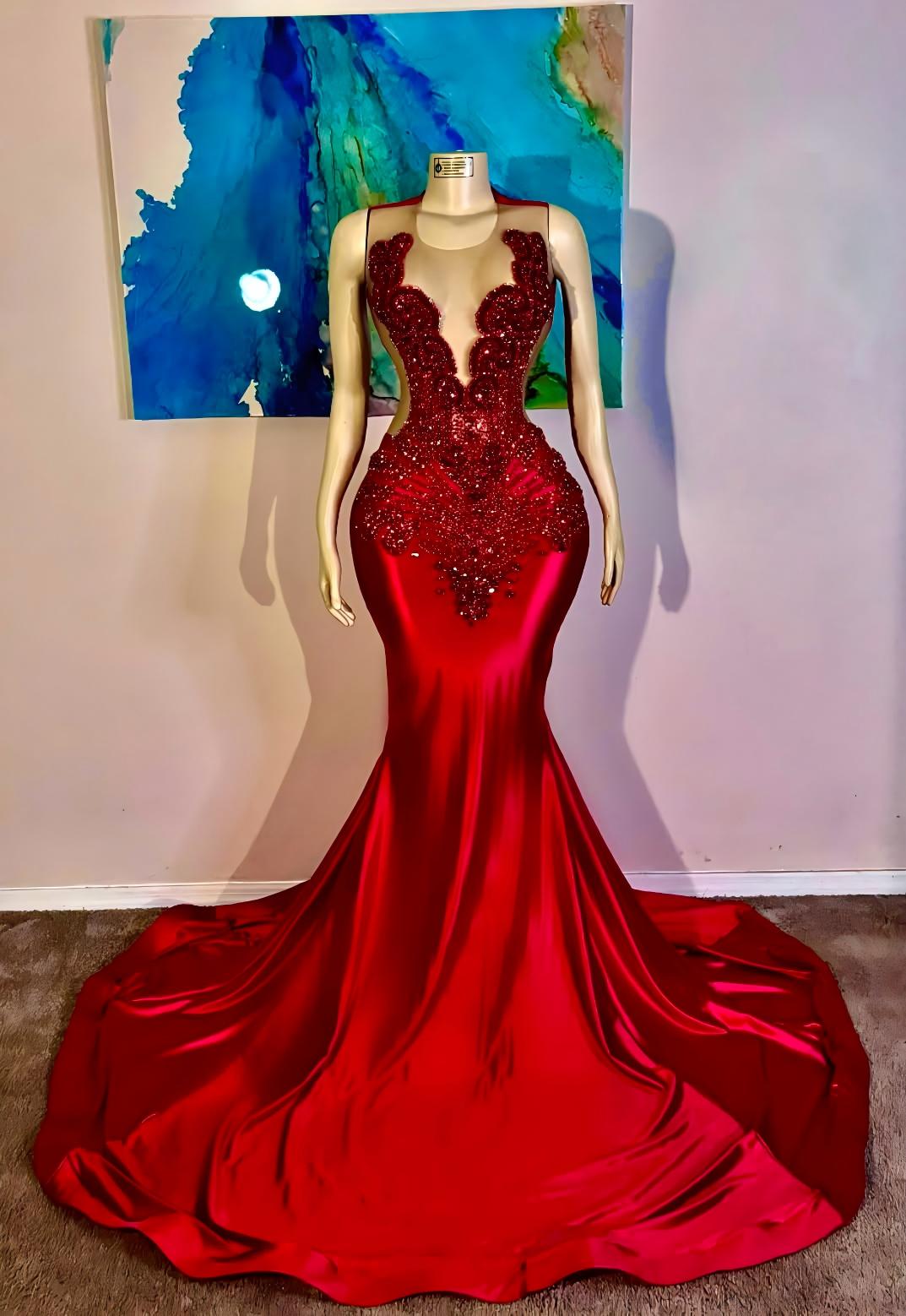 A floor-length red mermaid gown with a deep plunging neckline
