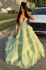 Woman in a light green formal gown