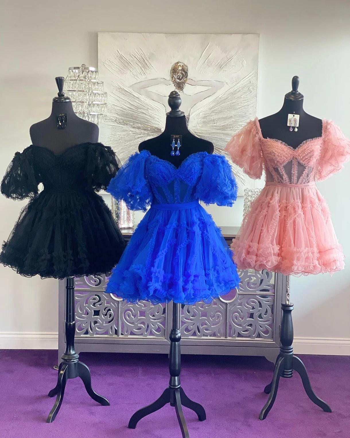 Three dresses on mannequins in black, blue, and pink Short Ruffles Homecoming Dress Tulle Off the Shoulder Mychicdress