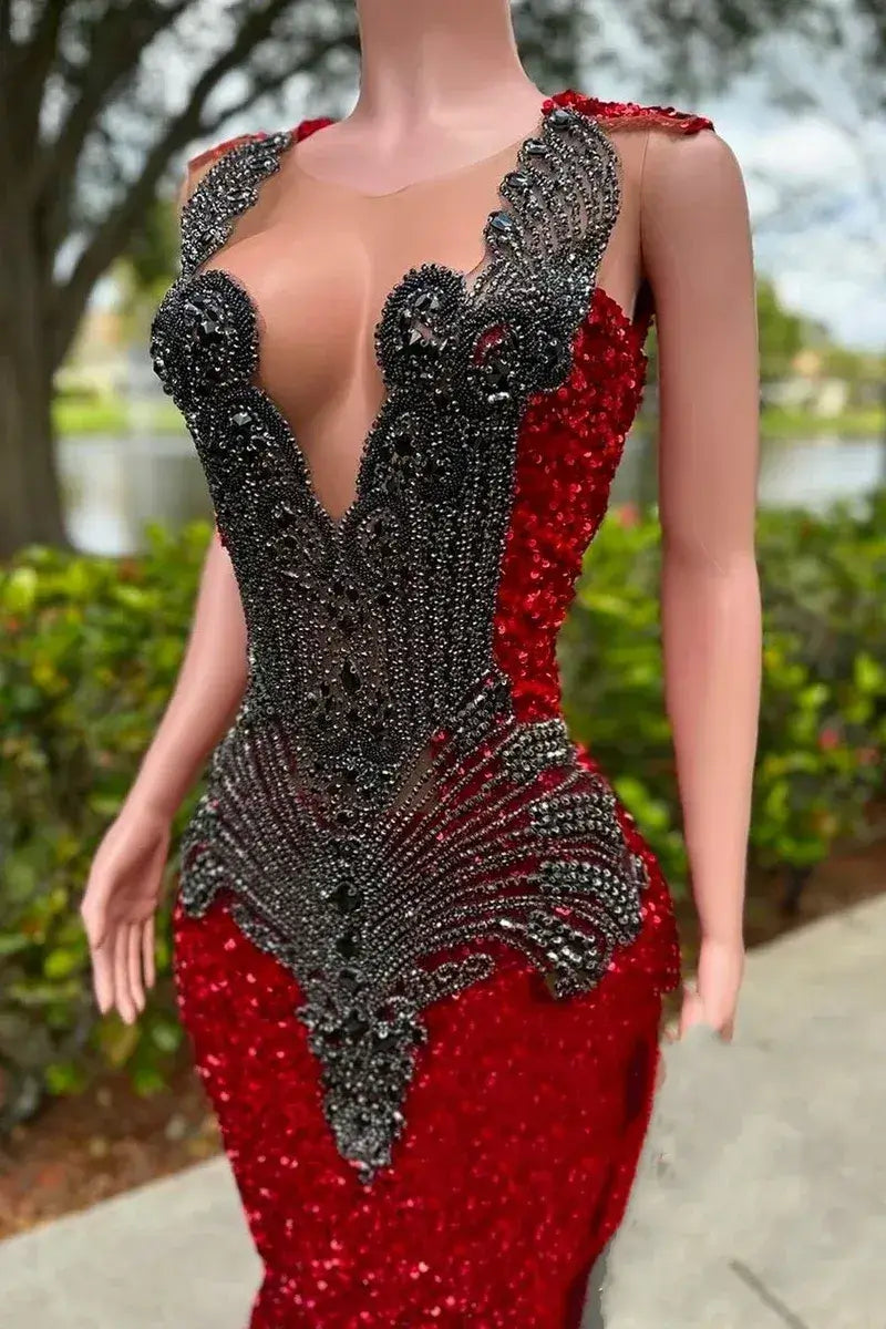 Red evening gown with black embellishments