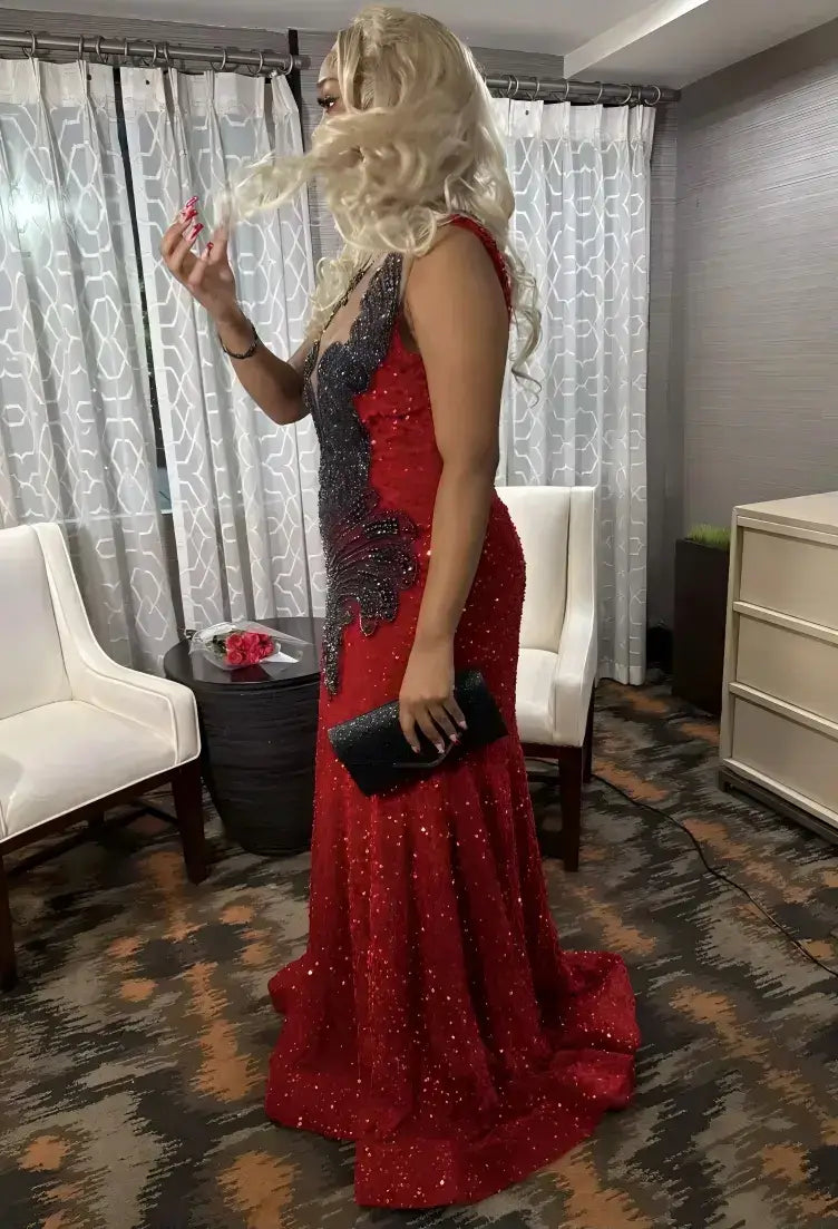 evening gown with black sequined side panels and a deep V-neckline
